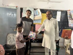 A kid receiving a book