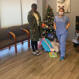 women standing near Christmas tree